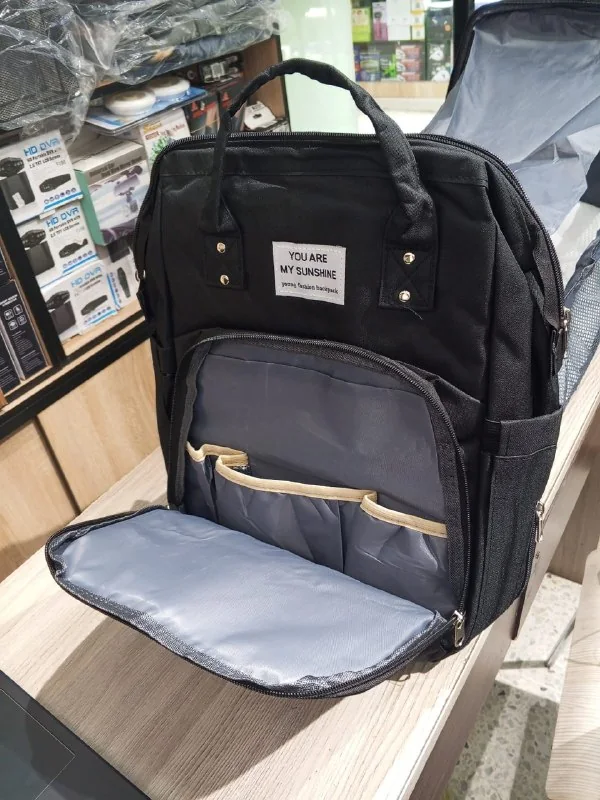 Pañalera con cambiador y cuna plegable tipo morral — foto 3
